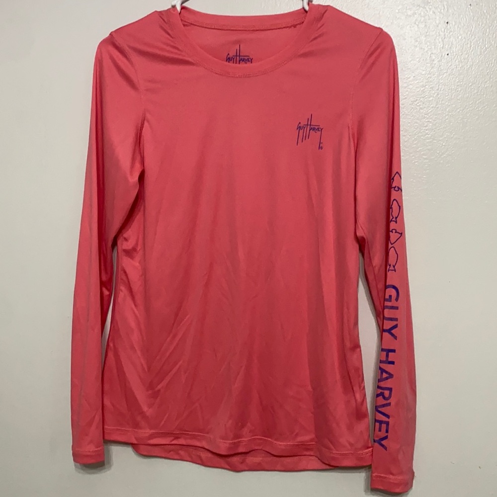 Guy Harvey long sleeve silky feel. 100% polyester. Great for in the sun!